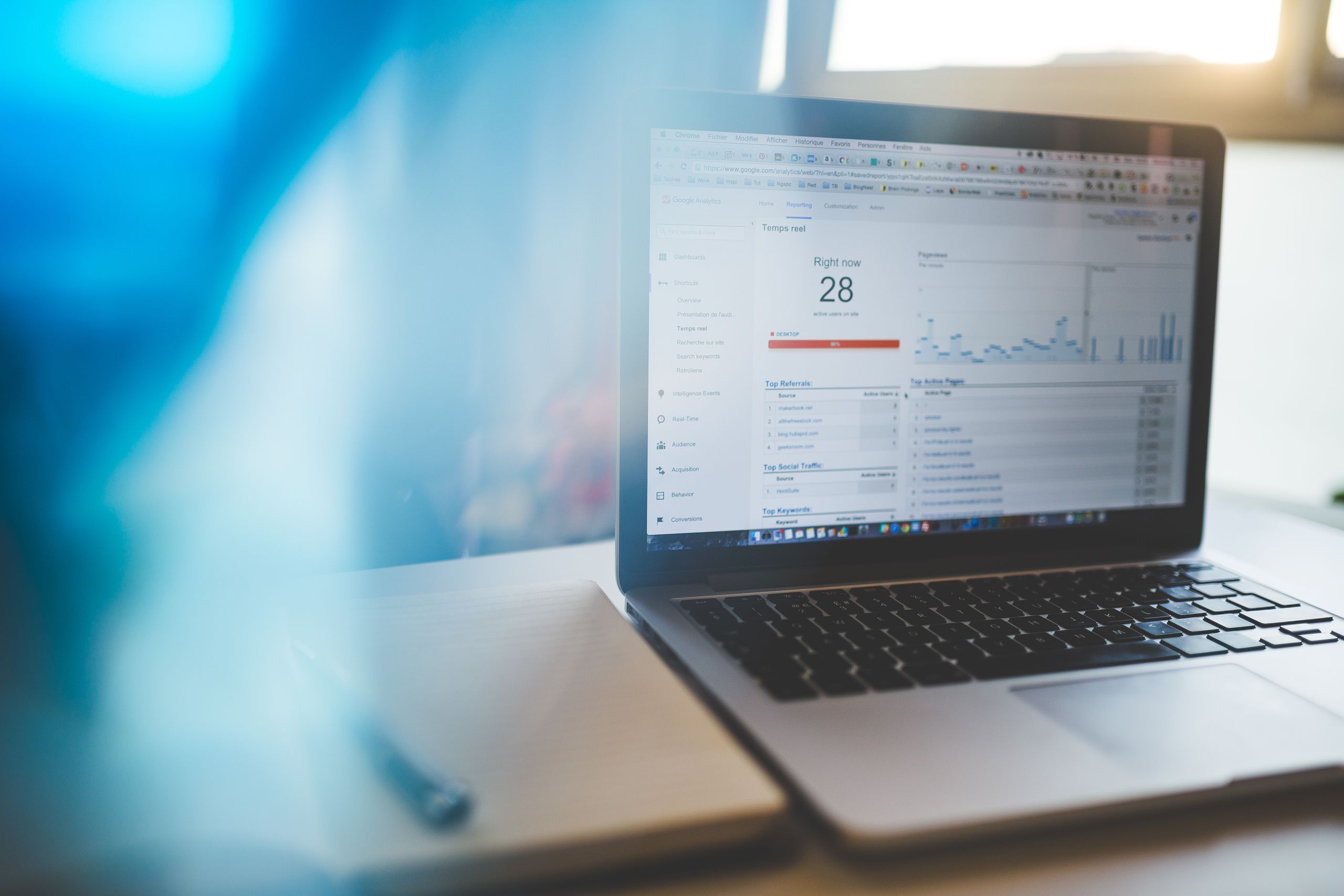 Laptop on a desk showing a Google Analytics traffic dashboard, representing WordPress SEO services