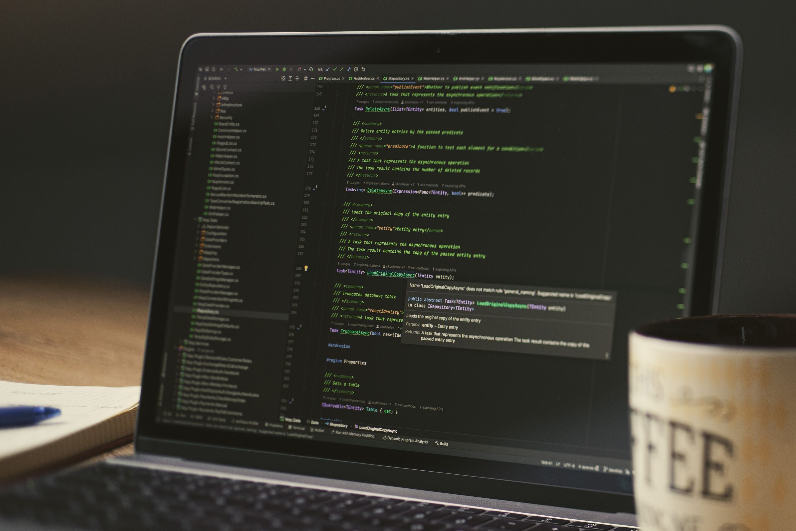 Laptop on a desk showing code in a dark editor, representing professional WordPress website development